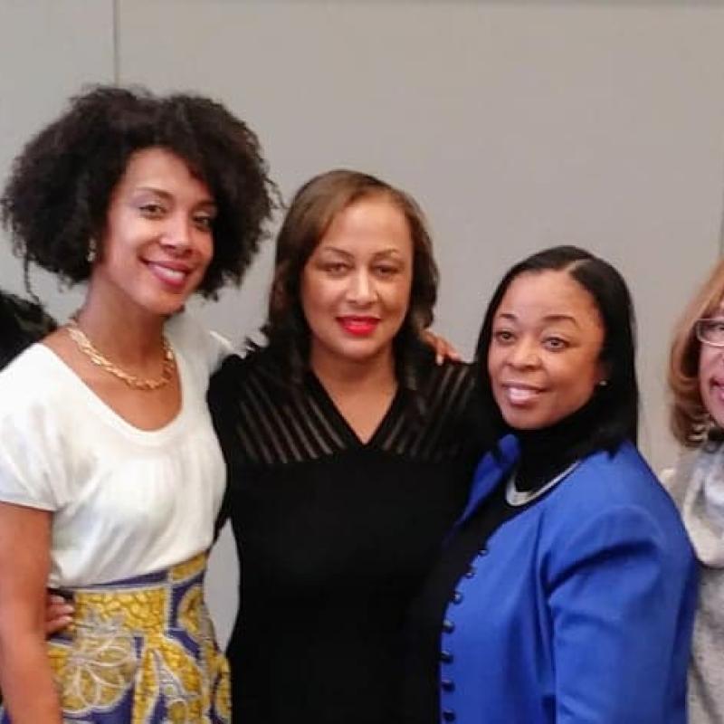Group of women smiling.