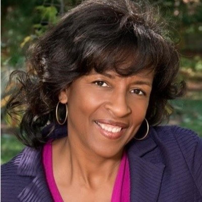 Headshot of woman smiling.