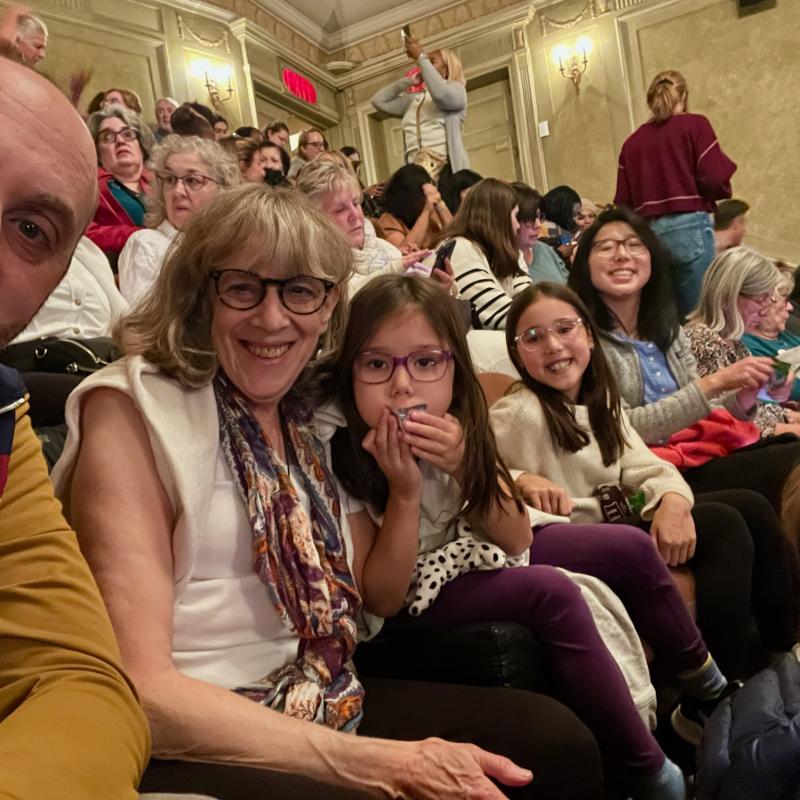 people together in the audience at a theater..