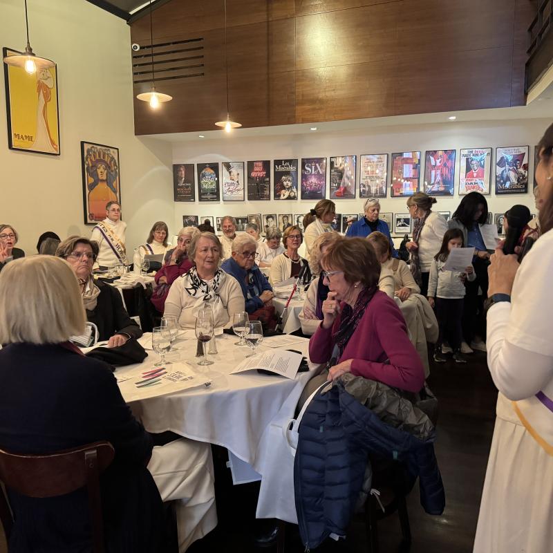 Fredie Kay speaking at restaurant for Suffs Trip