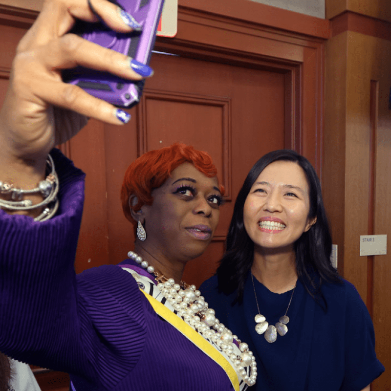 Two women take a selfie.