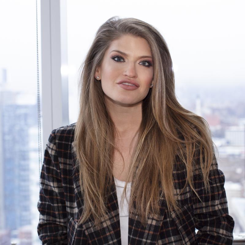 Headshot of woman with long hair.