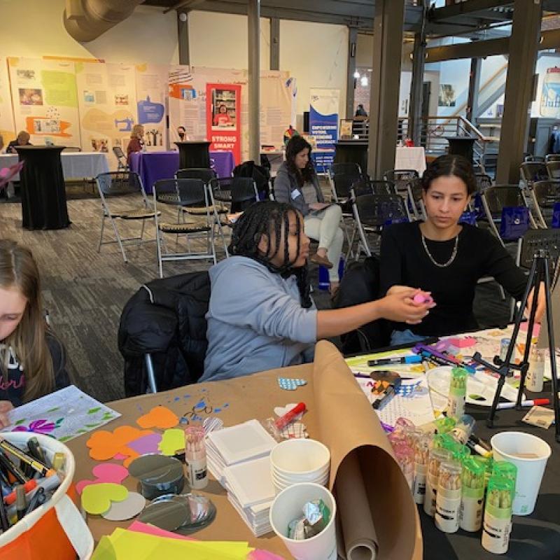 Three girls painting.