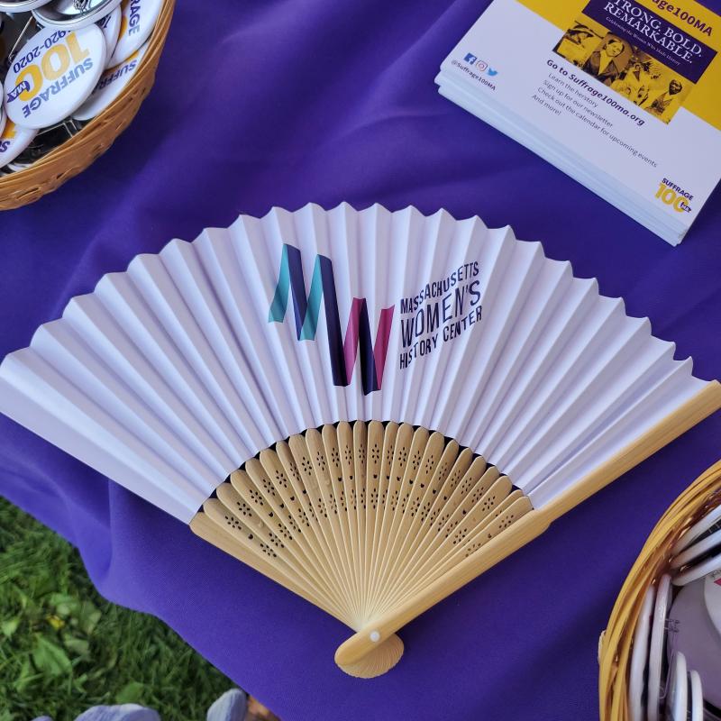 Paper fan on purple table.