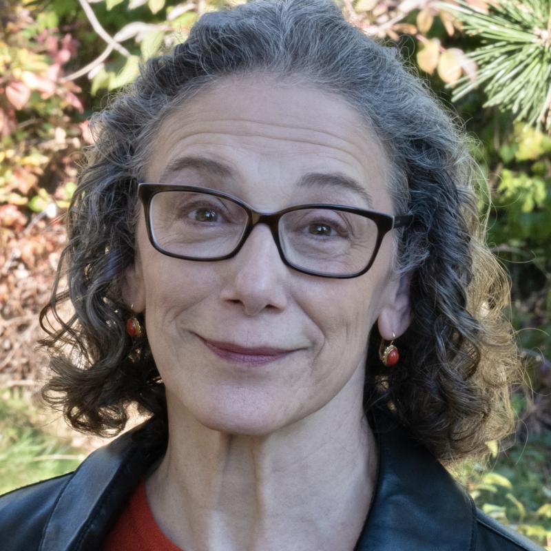 headshot of Meredith Bergmann standing outside wearing glasses