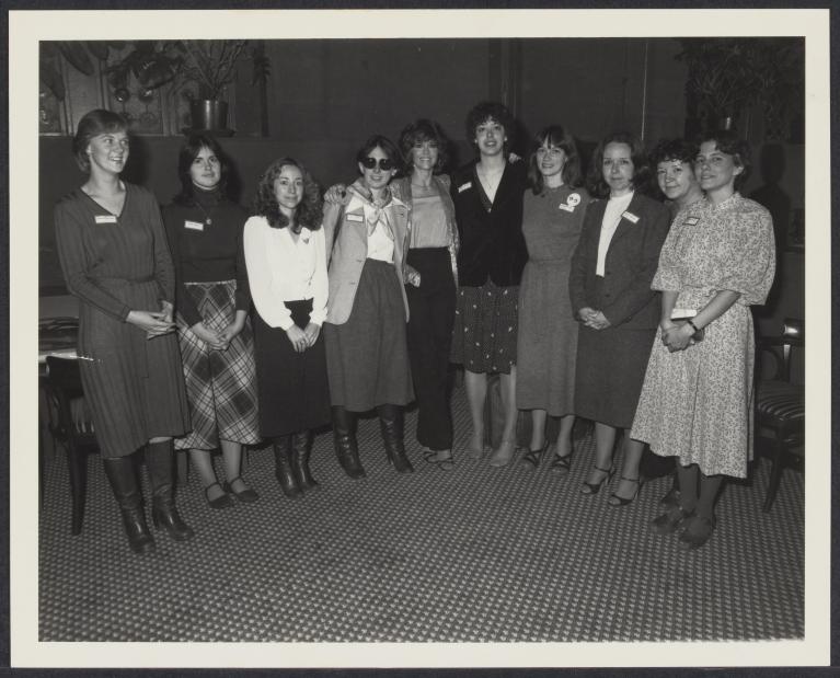 group of women wearing skirts, dresses, and business attire. 