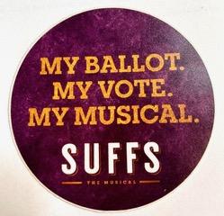 A picture of a button pin advertising the Broadway Musical Suffs! with the text My Ballot. My Vote. My Musical. Suffs!