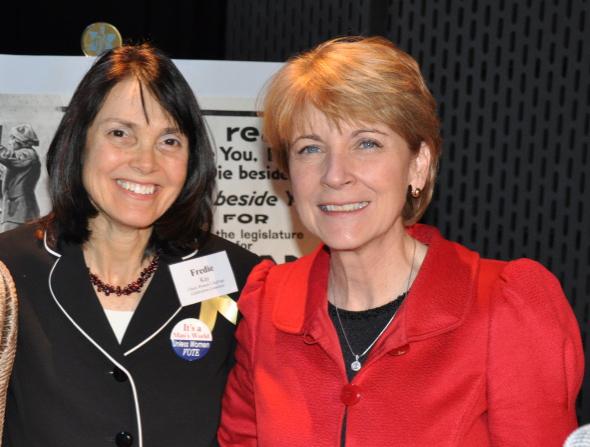 Two women standing side by side